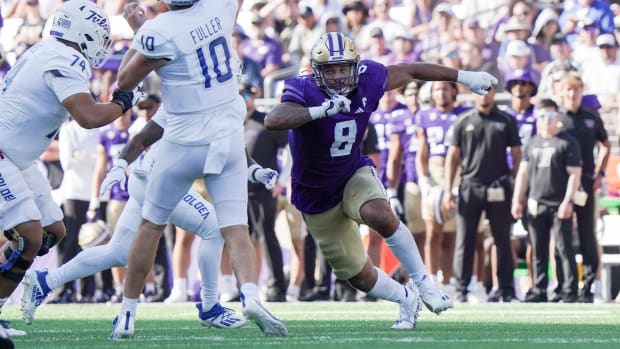 Bralen Trice bears down on the Tulsa quarterback, a scary sight.